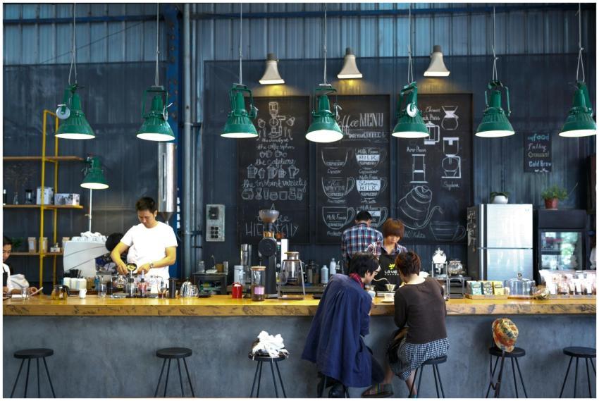 A bustling café with a modern industrial design, f