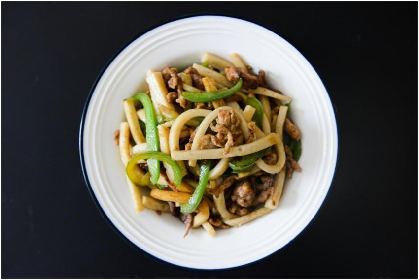 Delicious stir-fried udon noodles with pork and fr