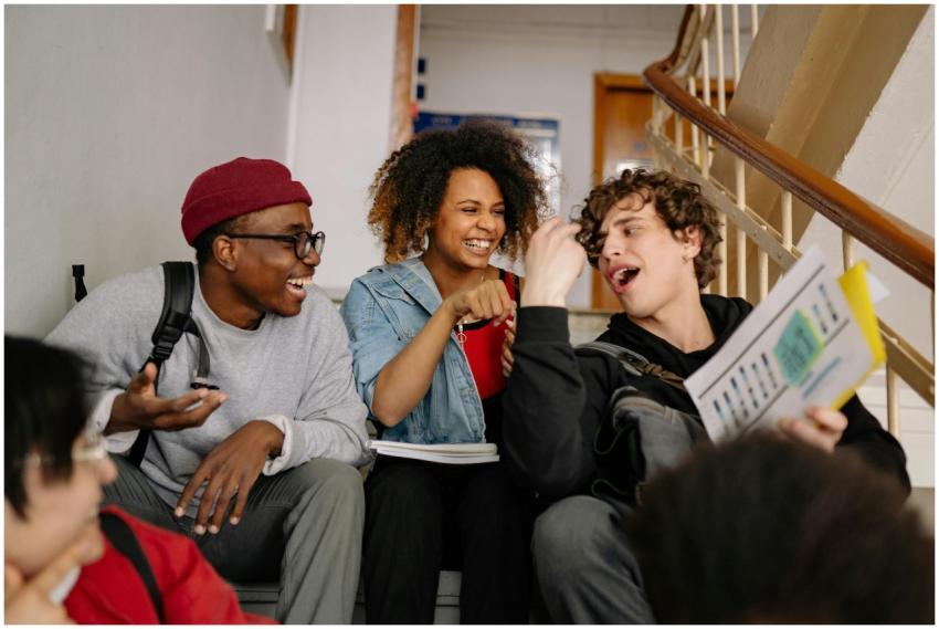 Happy group of diverse students laughing and bondi