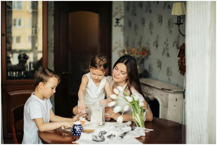 Mother and children baking together in a cozy home