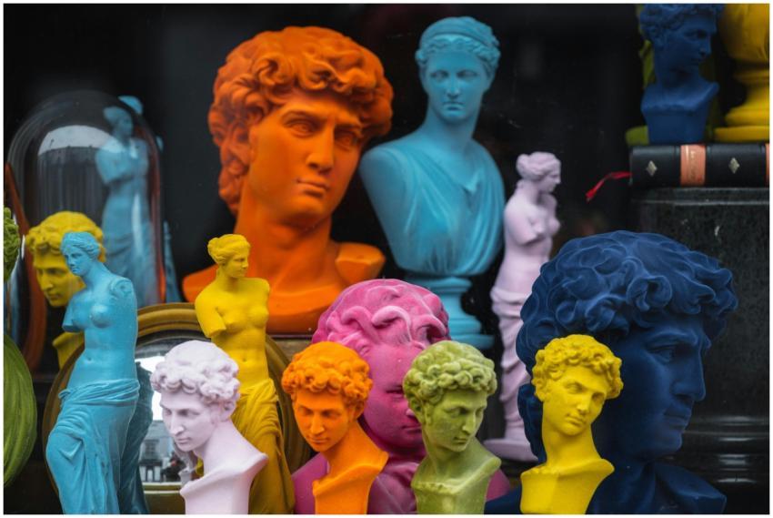 Multicolored head sculptures of David near bright