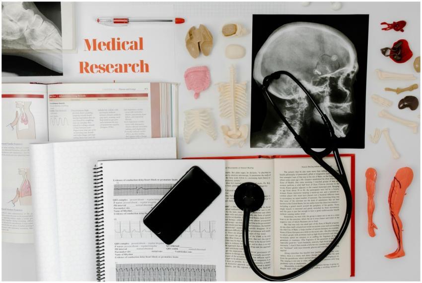 Flat lay of medical research materials with a stet