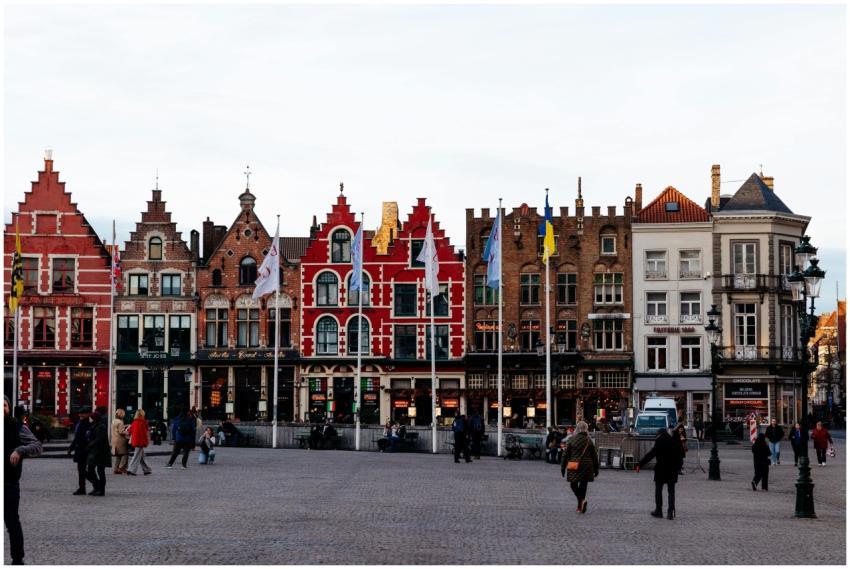 Vibrant medieval buildings lining a square in Brug