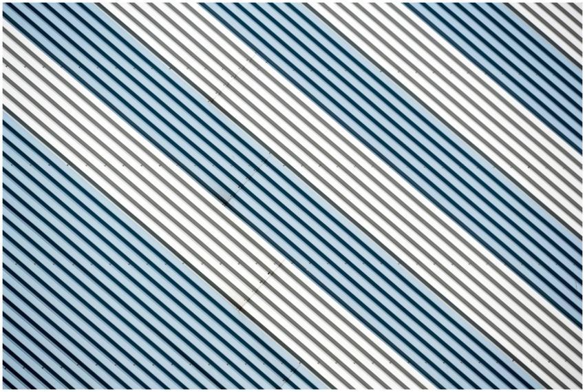 Abstract diagonal stripes in metallic tones create