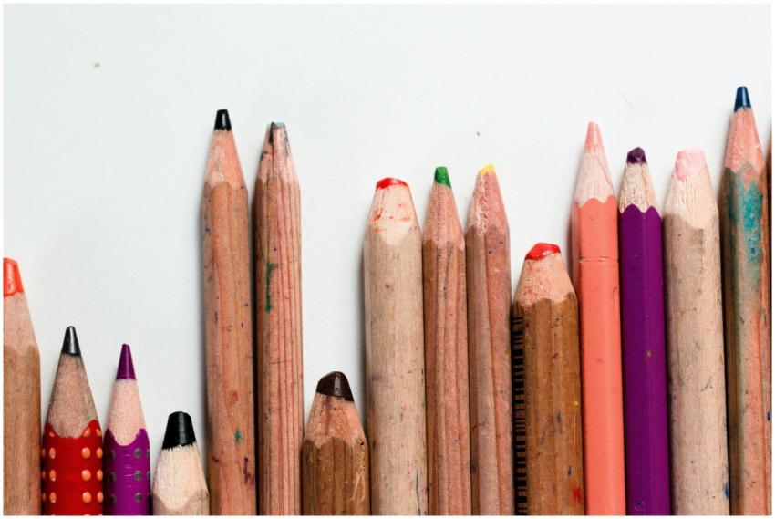 Close-up of assorted colored pencils arranged neat