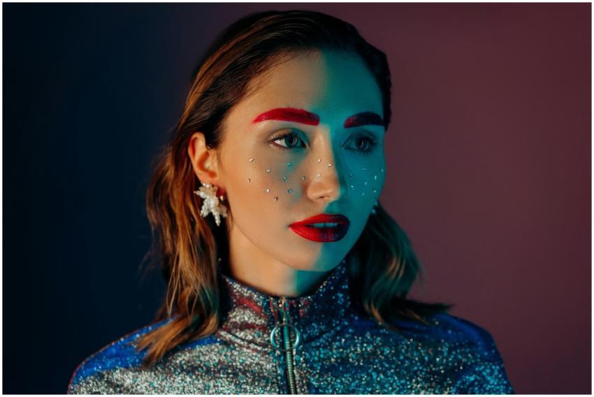 A striking portrait of a woman with vibrant makeup