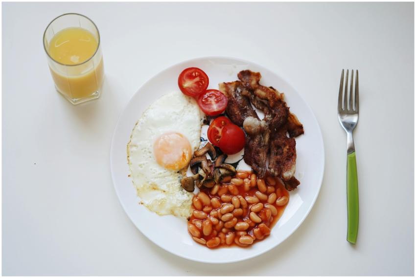 A mouth-watering breakfast featuring bacon, beans,
