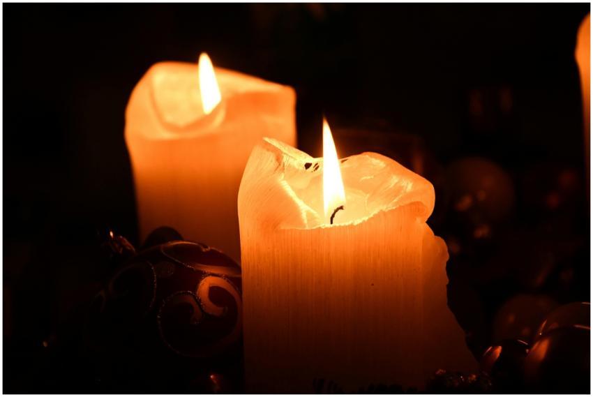 Warm and inviting close-up of burning candles, cre