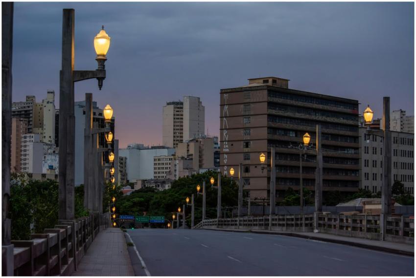 Evening view of city street and skyline in Belo Ho
