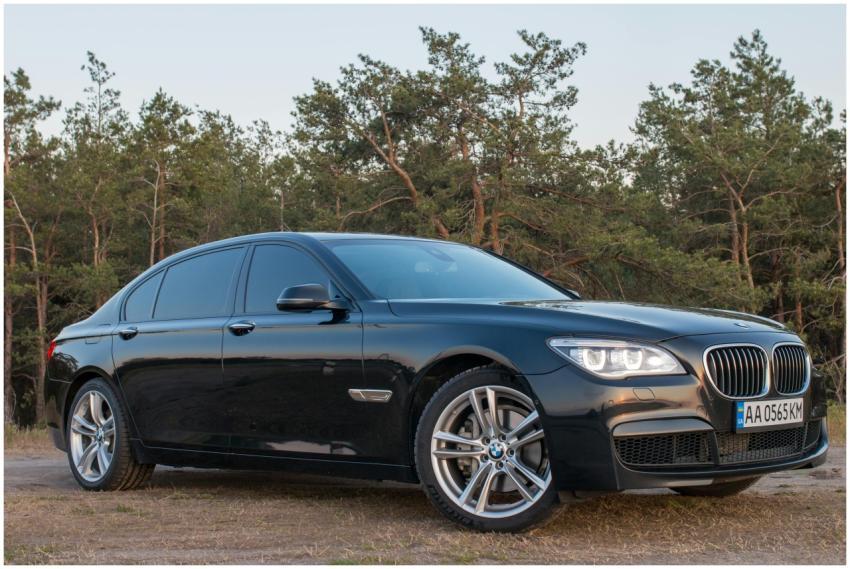 Luxurious black BMW sedan parked outdoors with for