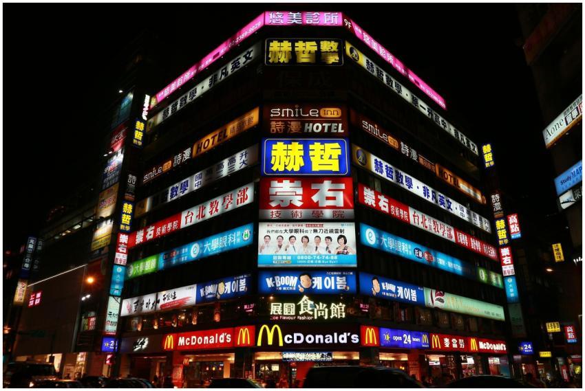 Illuminated building in Taipei showcasing vibrant