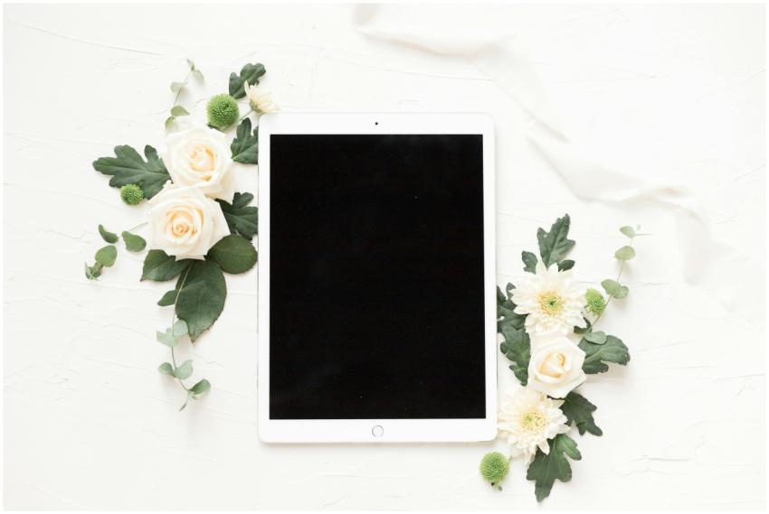 Stylish flatlay with white roses, chrysanthemums,