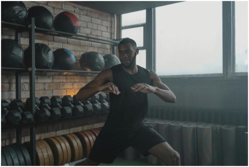 African American man engaged in a workout with gym