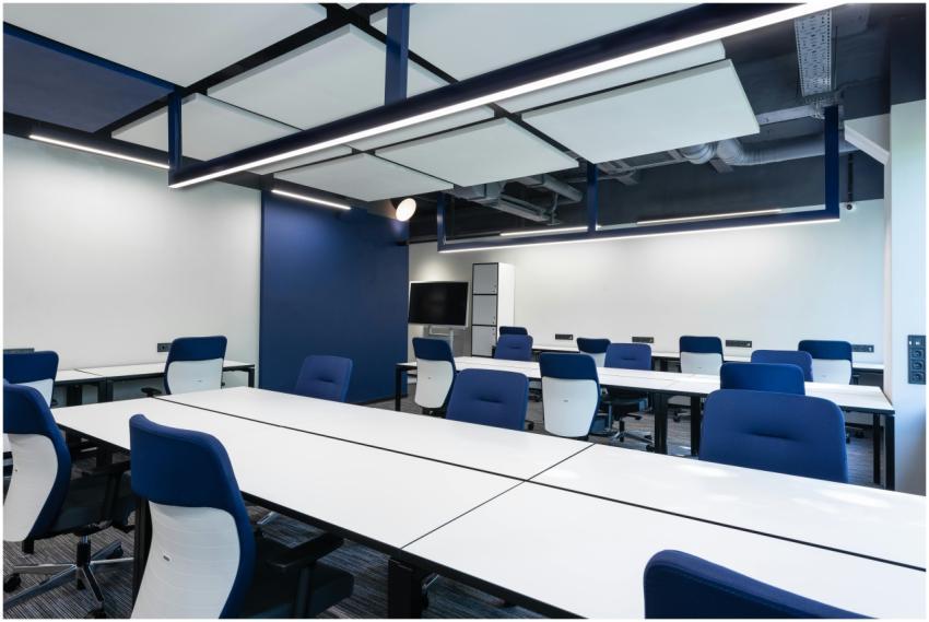 Interior of modern spacious workspace with long wh