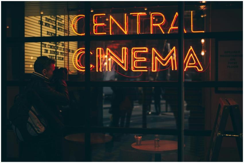 A photographer captures the vibrant neon glow of a