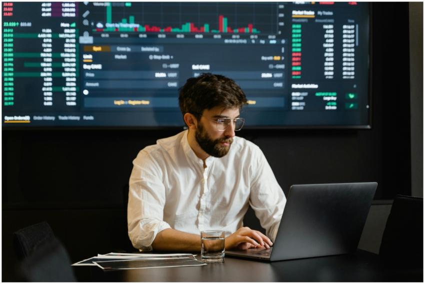 Professional analyzing stock market trends using l