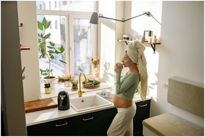 Pregnant woman enjoying a peaceful moment with tea