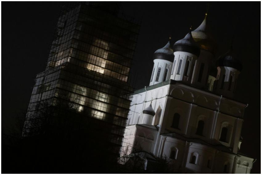 Night view of an illuminated cathedral with domes