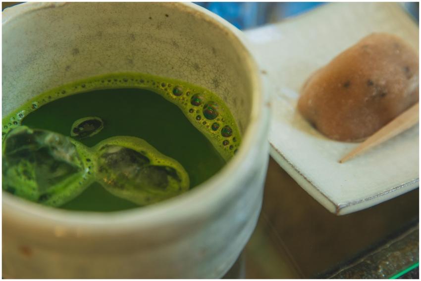 Close-up of a cup of matcha tea accompanied by a t