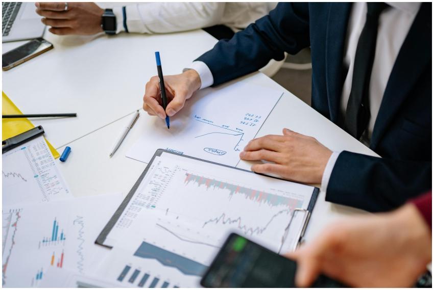 Professionals analyzing financial charts in a corp