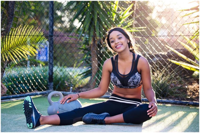 Young woman relaxing after a workout in a sunny ou