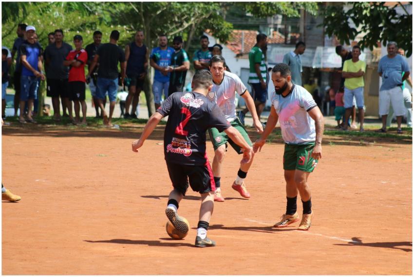 A lively amateur football game with players in act
