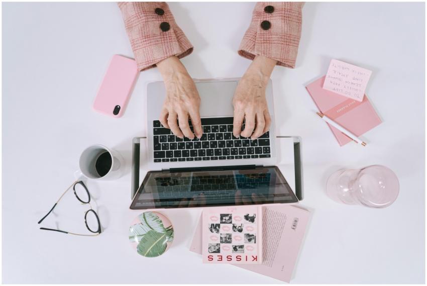 Stylish overhead shot featuring hands typing on a