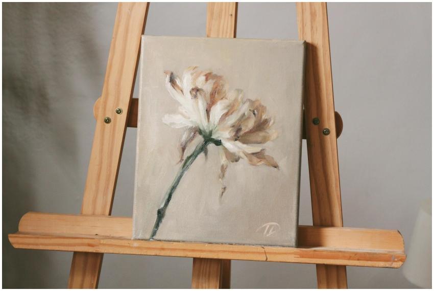 A delicate oil painting of a white flower displaye