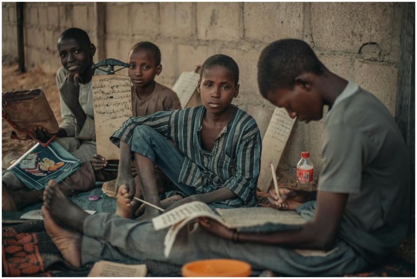 A group of African boys studying outdoors in Kano,