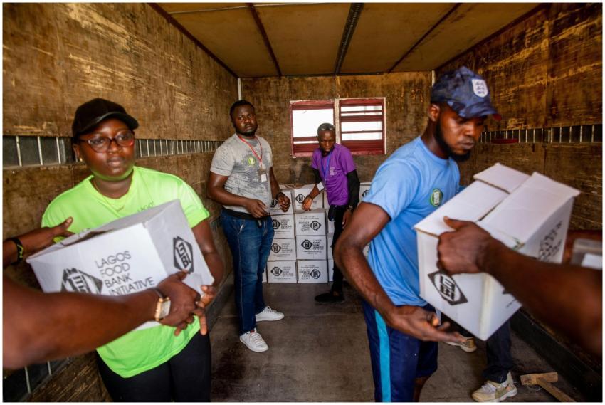 Dedicated volunteers organize food boxes in a truc