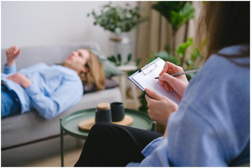A therapy session in progress with a therapist tak