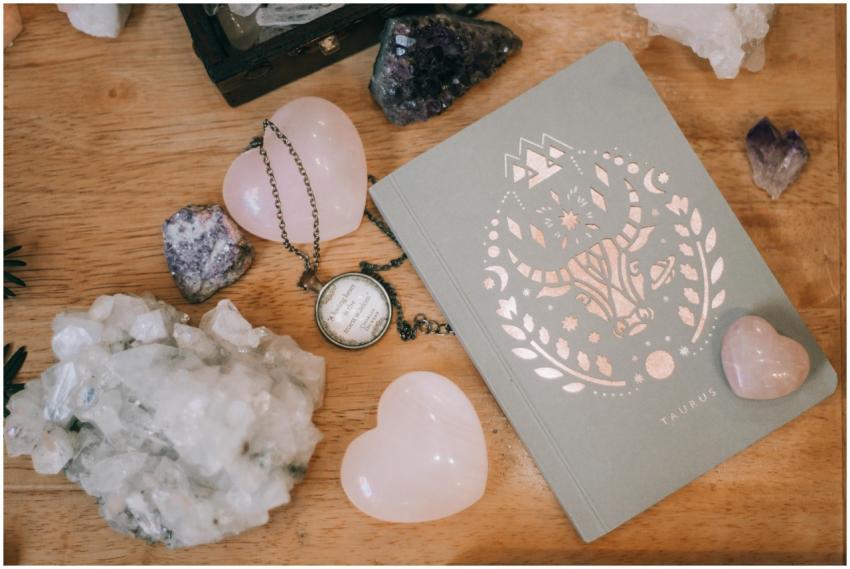 Taurus-themed notebook surrounded by heart-shaped