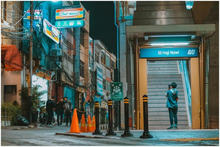 Vibrant urban street scene with people at night ne