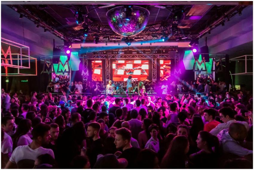 Dynamic crowd at a lively nightclub in Mantua, Ita