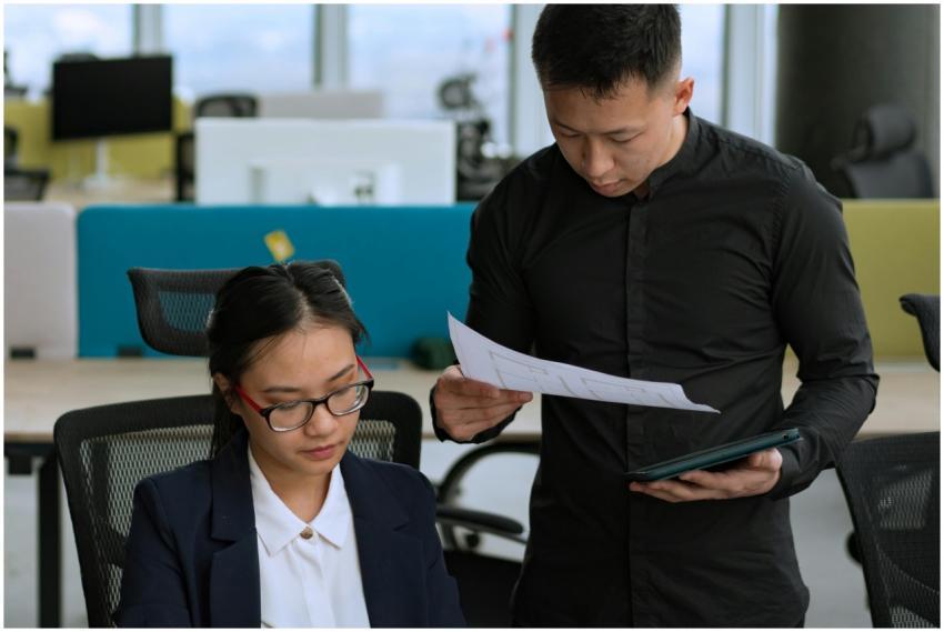 Two professionals collaborating on a project in a