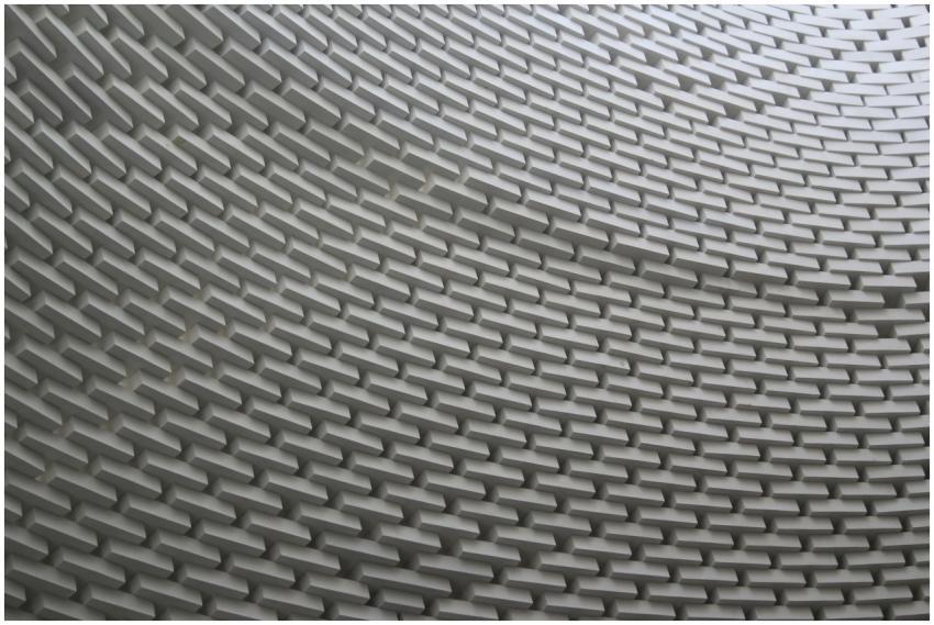 Abstract view of a wavy brick wall showcasing intr