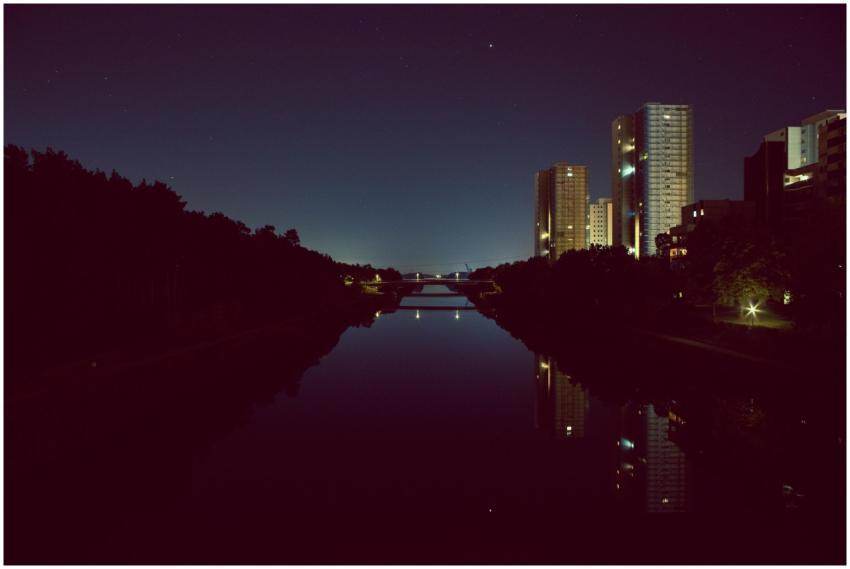 Captivating night view of city skyscrapers reflect
