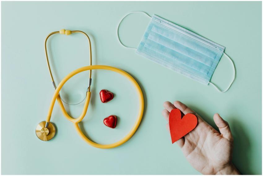 Top view of crop anonymous person hand with red pa