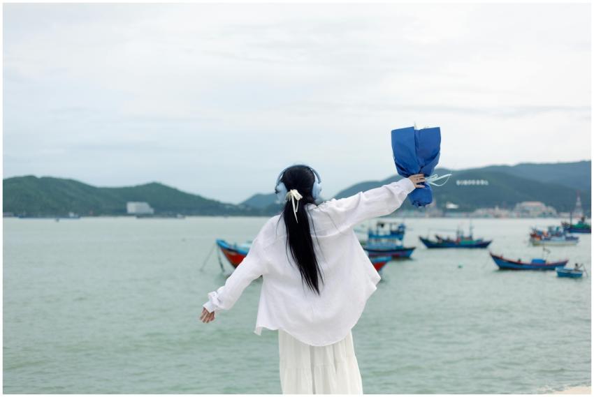 Woman Enjoying Sea Breeze