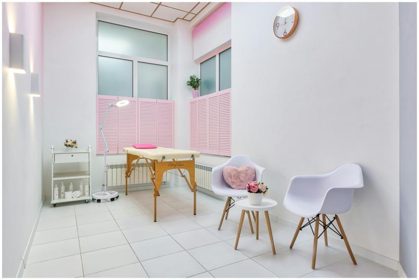 Interior of beauty salon with table for spa proced