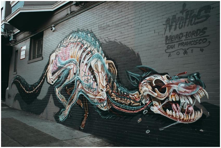 Colorful street art mural depicting a dragon on a