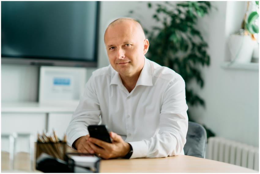 Businessman in a white shirt sitting in a modern o