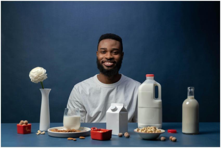 Smiling man enjoying a nutritious almond milk brea
