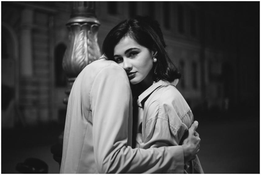 Romantic black and white photo of a couple embraci