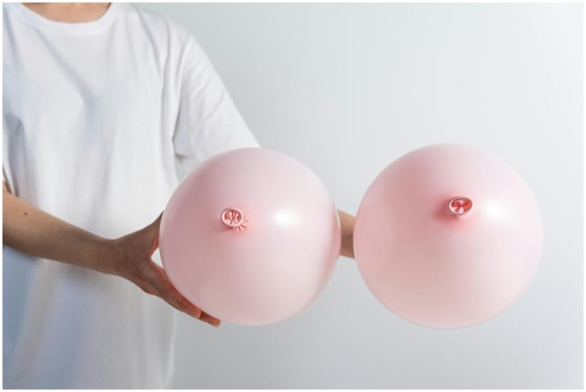 Pink balloons resembling breasts highlighting brea