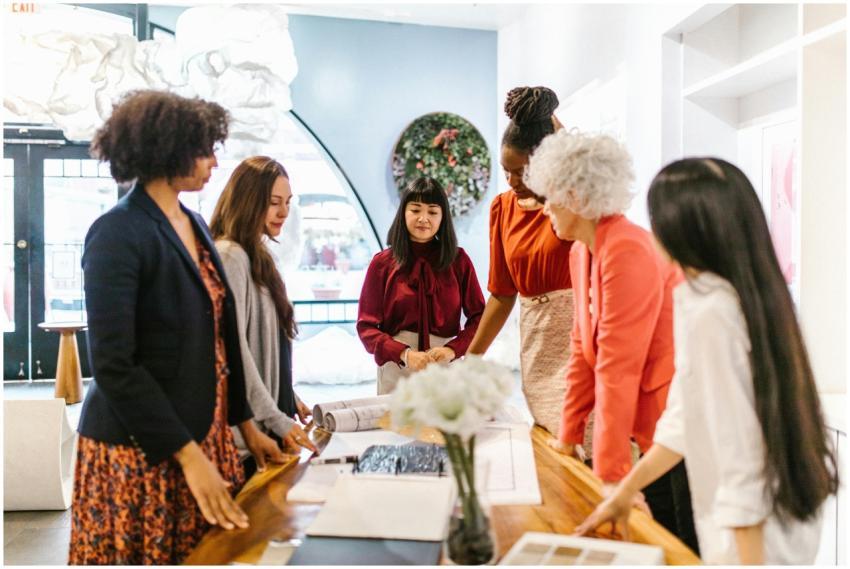 A diverse group of women engage in a business meet