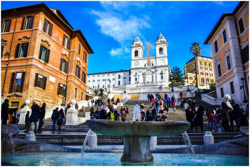 Tourists enjoying a sunny day at the iconic Spanis