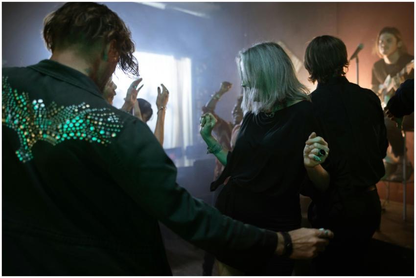 Energetic dance scene at a nightclub with live mus