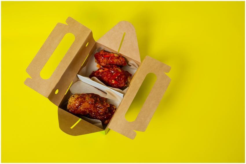 Savor spicy fried chicken wings in a box on a vibr