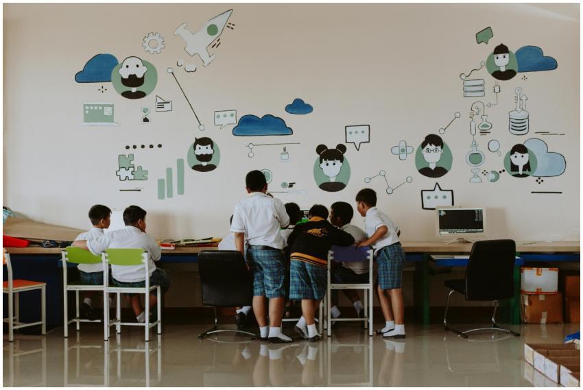 Students exploring technology in a colorful classr